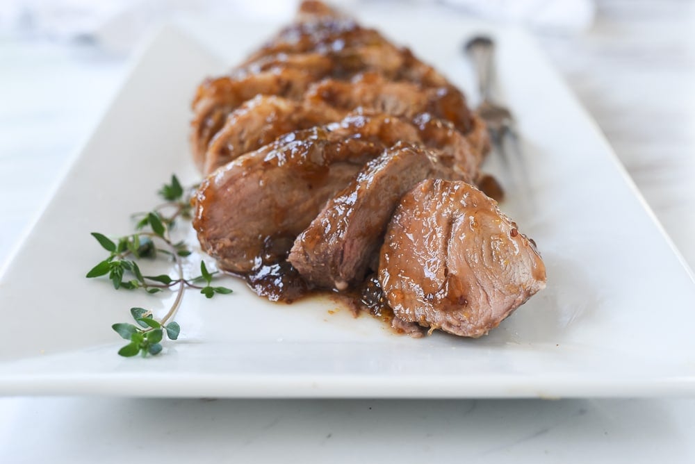 sliced fig pork tenderloin on a plate