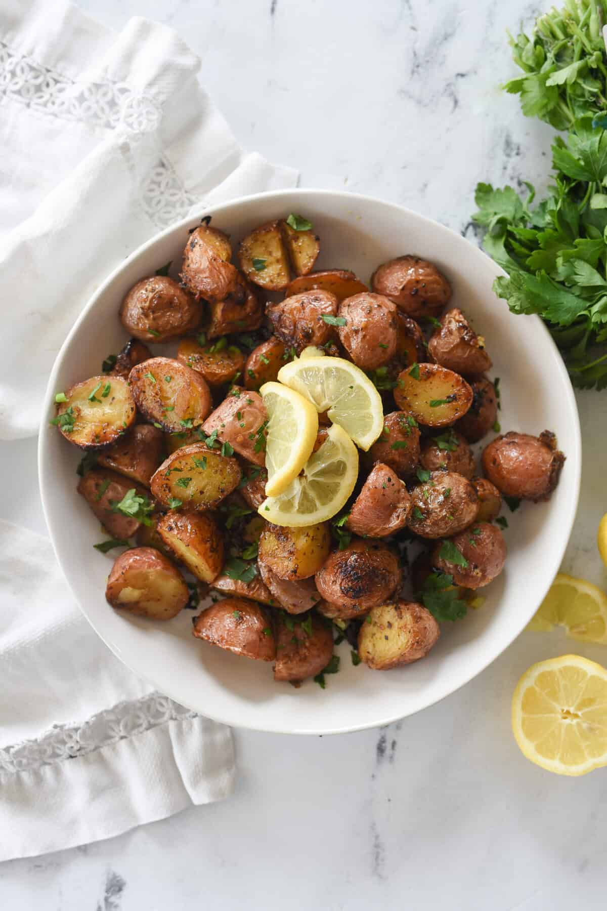 lemon roasted potatoes overhead shot of bowl of greek lemon potatoes