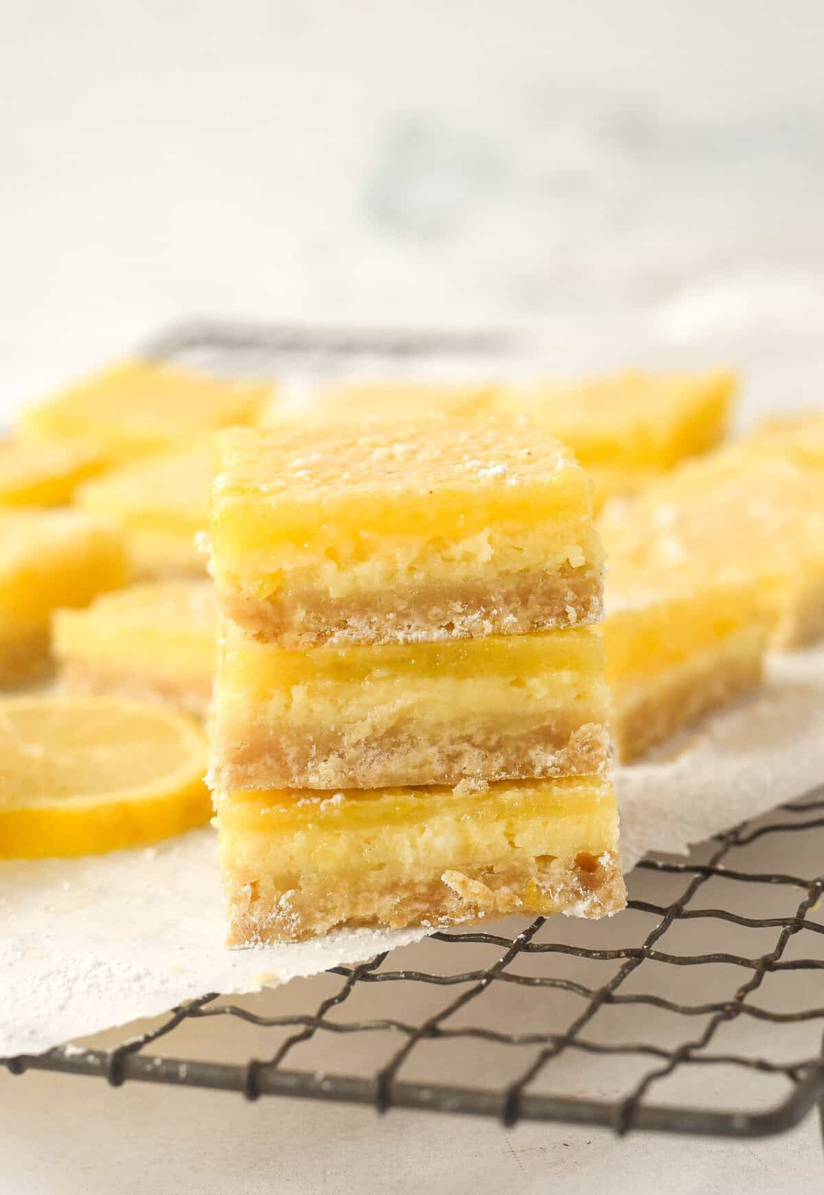 closeup of a stack of lemon cheesecake bars