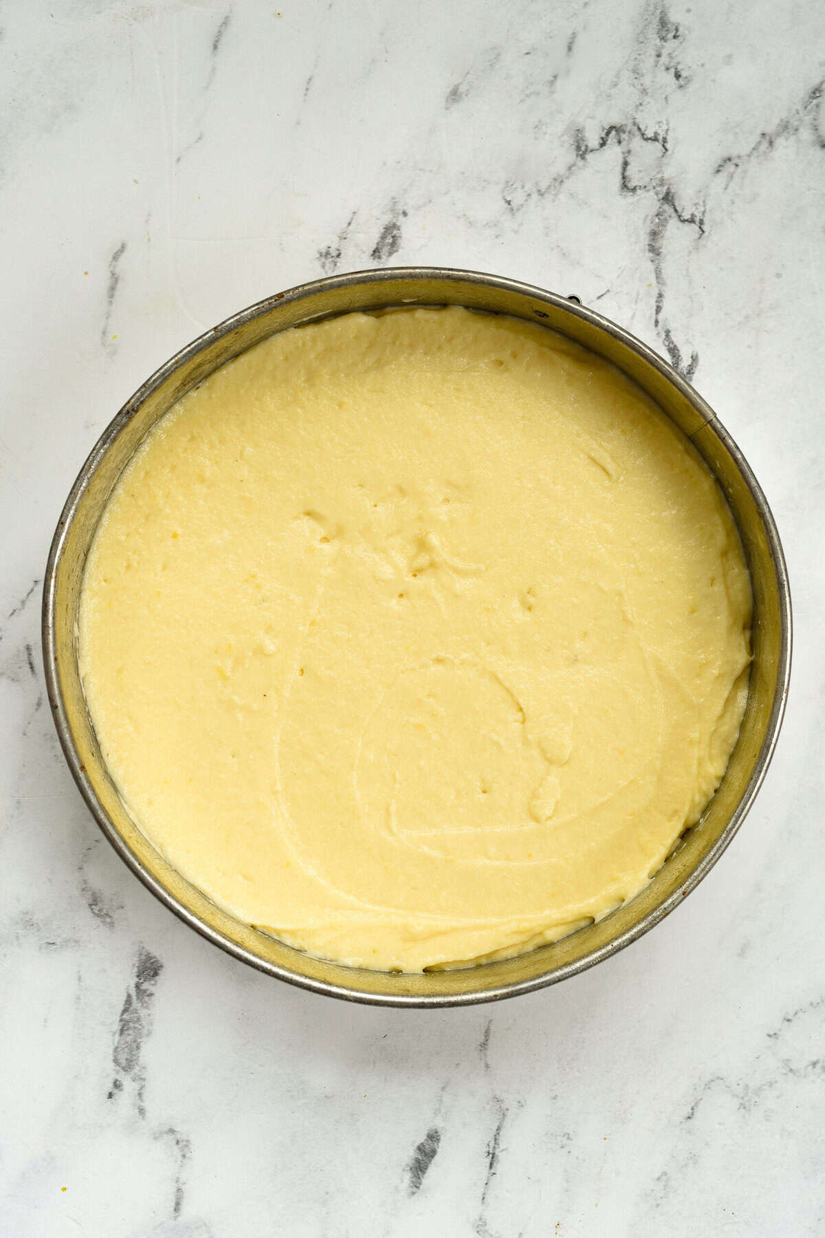 cake batter in a springform pan