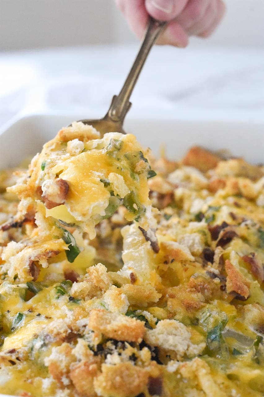 Loaded Scalloped Potatoes spoon full of potatoes