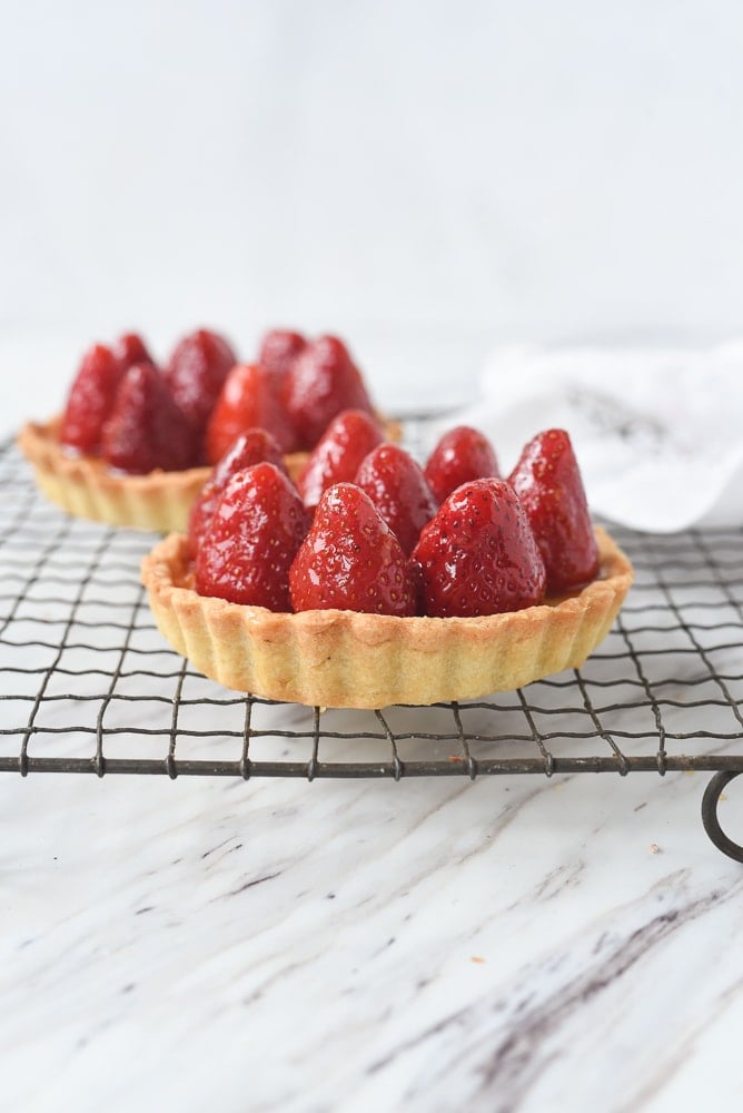 Strawberry Tart two strawberry tarts on a cooling rack