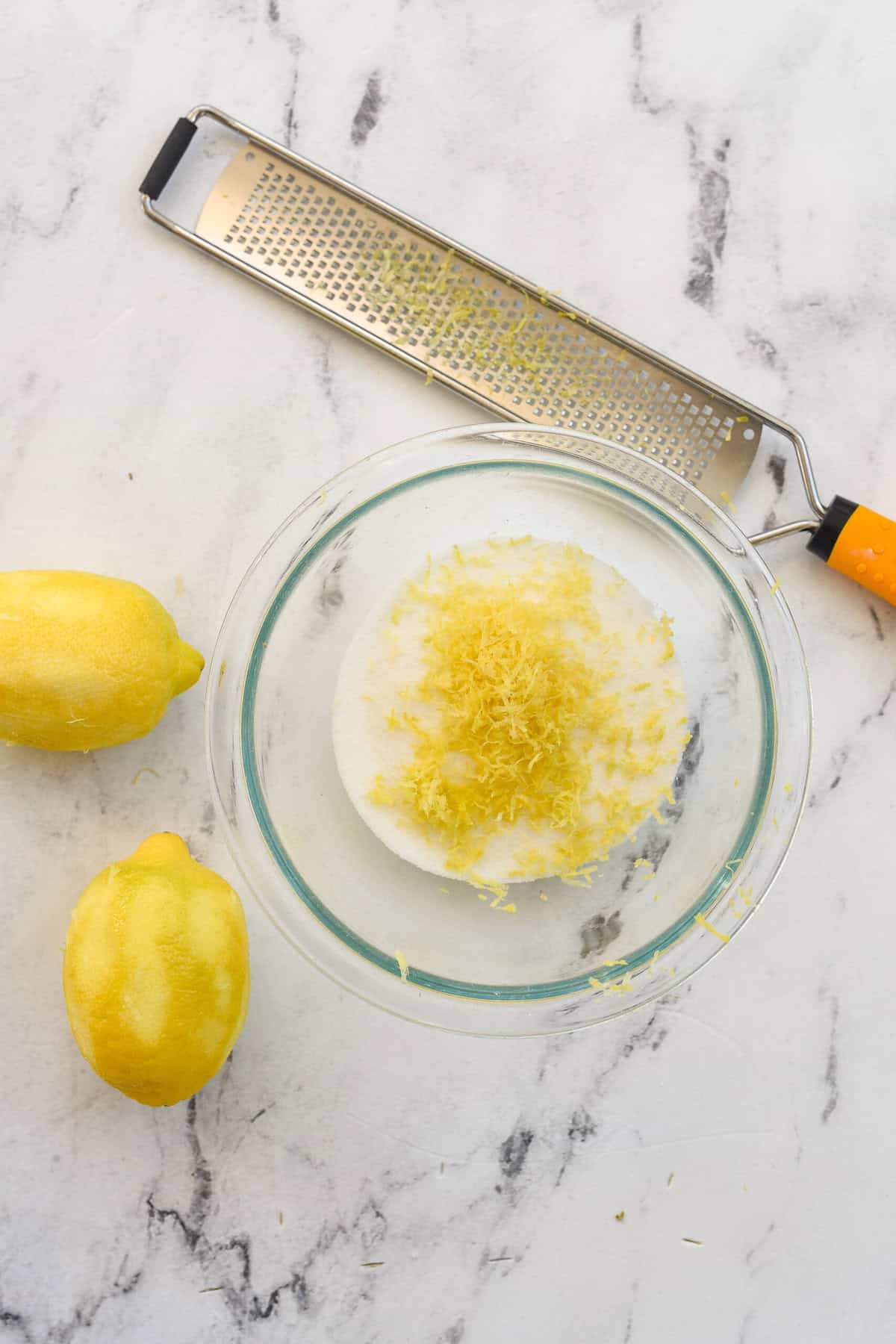 making lemon sugar with lemon zest and sugar